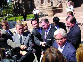 From left: Sam Hammond, president of the Elementary Teachers’ Federation of Ontario, Ken Coran, president of the Ontario Secondary School Teachers’ Federation and Fred Hahn, president of CUPE Ontario, speak to reporters Tuesday after being escorted out of Queen’s Park.
Jonathan Jenkins/QMI Agency
From left: Sam Hammond, president of the Elementary Teachers’ Federation of Ontario, Ken Coran, president of the Ontario Secondary School Teachers’ Federation and Fred Hahn, president of CUPE Ontario, speak to reporters Tuesday after being escorted out of Queen’s Park.
