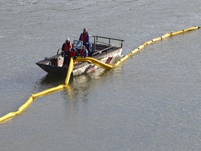 Crews work during a half-day oil spill training exercise held at Capilano Park along the North Saskatchewan River in Edmonton, Alberta on September 12, 2012. Workers with Enbridge Pipelines Inc., Pembina Pipeline Corporation as well as Edmonton Fire Rescue Service personnel participated. IAN KUCERAK/EDMONTON SUN/QMI AGENCY