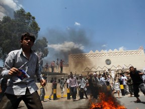 Protesters gather outside the U.S. embassy in Sanaa on September 13, 2012. (REUTERS/Khaled Abdullah)