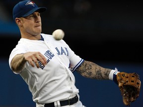 Brett Lawrie of the Toronto Blue Jays throws to first base against the Seattle Mariners during MLB action at the Rogers Centre September 13, 2012 in Toronto, Ontario, Canada.  (Abelimages/Getty Images/AFP)
