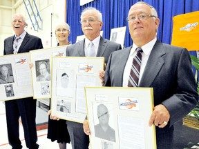 Bob Weedon, right, Roy Galloway, Fran Crummer (whose plaque was accepted by her daughter Diane Teetzel) and Dave Allin were inducted Thursday into the Chatham Sports Hall of Fame at the WISH Centre. (DIANA MARTIN/The Daily News)