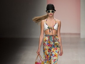 A model presents a creation by Caroline Charles during their 2013 spring/summer collection catwalk show at London Fashion Week in London on September 14, 2012. AFP PHOTO / BEN STANSALL