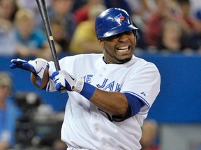 Blue Jays batter Edwin Encarnacion reacts after being hit by a pitch during the third inning of his team's game against the Seattle Mariners in Toronto September 13, 2012. (MIKE CASSESE/Reuters)