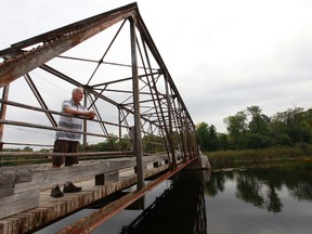 Tom Beach stands near the Andrewsville Bridge near Merrickville, Ontario, Friday Sept 14, 2012. Tom and his community would love to save the bridge, which goes over the Rideau River. Tony Caldwell/Ottawa Sun/QMI Agency