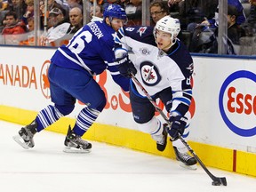 Alex Burmistrov salary: $900,000. Per game: $10,975 (Dave Abel/ Toronto Sun/QMI Agency)