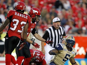 Bombers RB Chad Simpson (right) says his team has to play with more pride and dignity. (Al Charest/QMI AGENCY)