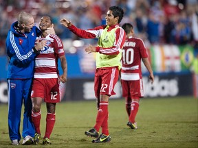 Guzman #12 of FC Dallas celebrates the game winning goal with teammates against the Vancouver Whitecaps FC on September 15. Cooper Neill/Getty Images/AFP