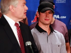 Pittsburgh Penguins hockey player Sidney Crosby watches as Donald Fehr, executive director of the National Hockey League Players Association, speaks at a news conference in New York September 13, 2012. (REUTERS)