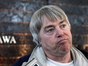Robert Latimer, who been granted day parole after serving seven years in prison for the 1993 "mercy killing" of his severely handicapped daughter Tracy, speaks with journalists at the Ottawa International Airport in Ottawa March 17, 2008.      REUTERS/Chris Wattie