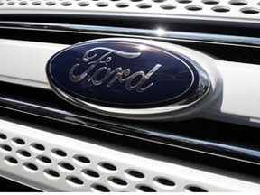 A Ford logo is pictured during the unveiling ceremony of the new 2011 Ford Explorer in Chicago, July 26, 2010. (Reuters/JOHN GRESS)
