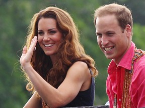 Prince William and Catherine, the Duchess of Cambridge, smile as they watch a shark ceremony during their arrival at Marapa Island, Solomon Islands, September 17, 2012. Prince William and Catherine, the Duchess of Cambridge, are at the third stop of a nine-day tour of Southeast Asia and the South Pacific on behalf of Queen Elizabeth II to commemorate her Diamond Jubilee. (REUTERS/Rick Rycroft)