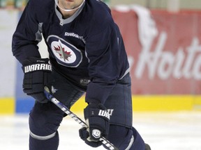 Mark Stuart works out at the MTS Iceplex on Friday, prior to the NHL's work stoppage that kicked in on Saturday. Once the players were locked out by the league, none of them were wearing Jets' practice jerseys on Monday when they gathered to skate.