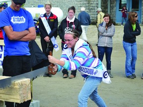 The 149th Lucknow Fall Fair was a big hit with all those who attended this past weekend. There were events for the whole family from agricultural shows, music, games, good food, etc. The recently crowned 2012 Lucknow Fall Fair Ambassador Kara Hendricks puts a little elbow grease into the log-sawing event held on Saturday.