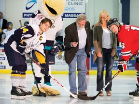 Eagles captain Riley Point, left,  faces off against Whitecourt Wolverines' Jamie Johnson in the first home game for Canmore during the 2012-2013 Alberta Junior Hockey League season. The Eagles mascot joined Mayor John Borrowman and the Town's chief operating officer Lisa de Soto, who has had two sons in the Canmore program on Sept. 14, 2012. The Eagles management is upbeat following a season of gains on and off the ice this past winter. File photo