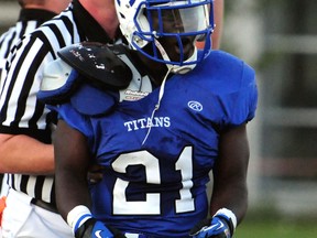 Harry Ainlay Titans running back David Adebayo celebrates a touchdown during an exhibition game against the McNally Tigers at Clarke Stadium on Thursday, September 13, 2012. The Titans won the game 47-0. TREVOR ROBB/EDMONTON EXAMINER