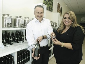Owners Tony and Val Vagopoulos display their products in an easy to access store offering 50 different specialty oils and vinegar in Whitby. (Veronica Henri/Toronto Sun)