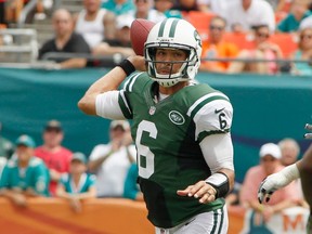 New York Jets quarterback Mark Sanchez throws against the Miami Dolphins in the first half during their NFL football game in Miami, Florida, September 23, 2012.  REUTERS/Joe Skipper