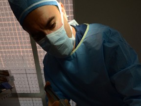 Plastic surgeon Dr. Askan Ghavami performs buttock enhancement cosmetic surgery on September 10, 2012 in Beverly Hills, California. (AFP PHOTO/JOE KLAMAR)