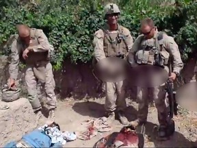 A still image taken January 11, 2012 from an undated YouTube video shows what is believed to be U.S. Marines urinating on the bodies of dead Taliban soldiers in Afghanistan.   REUTERS/YouTube