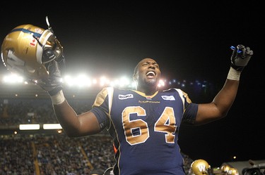 Winnipeg Blue Bombers offensive lineman Chris Greaves celebrates the Bombers' 32-25 victory over the Hamilton Tiger-Cats in CFL football in Winnipeg Thursday August 16, 2012.
BRIAN DONOGH/WINNIPEG SUN/QMI AGENCY