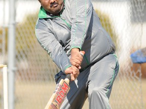 Rogers Pillay connects with the ball during a cricket game hosted by the Grande Prairie Cricket Association at Avondale School in April. (IVAN DANIELEWICZ/DAILY HERALD-TRIBUNE)