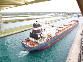 The freighter the Algoma Guardian passes through the Soo Locks under the International Bridge between Sault Ste. Marie, Ont. and Sault, Mich., on Monday, Sept. 24, 2012. The structure, which spans the St. Mary's River connecting Sault, Ont. with Sault Ste. Marie, Mich., is 50 years old this year. (Sault Star File Photo)