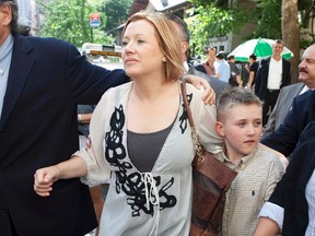 Accused Upper East Side Madam Anna Gristina leaves Manhattan Supreme Court with son Nicholas Gorr in New York August 16, 2012. Gristina, a suburban mother of four, who prosecutors say ran a highly profitable brothel out of a Manhattan apartment, will appear in court October 15, 2012. (REUTERS/Andrew Kelly)