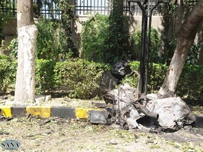 A view shows the wreckage after two blasts at a military headquarters in Damascus Sept. 26, 2012,in this handout photograph released by Syria's national news agency SANA. REUTERS/SANA