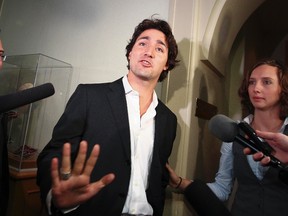 Liberal MP Justin Trudeau walks past the media before the Liberal Caucus at Parliament Hill in Ottawa on September 26, 2012. (ANDRE FORGET/QMI Agency)