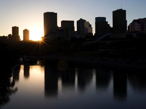 The sun sets behind the downtown skyline in Edmonton on September 17, 2012. (AMBER BRACKEN/QMI Agency)