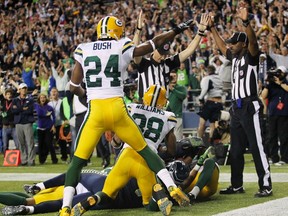 A referee indicates a Seattle Seahawks game winning touchdown over the Green Bay Packers during the fourth quarter of their NFL football game in Seattle, Washington, in this September 24, 2012 file photo. (REUTERS)