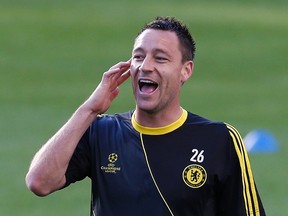 Chelsea's John Terry has been suspended for four matches for racially abusing Rangers defender Anton Ferdinand. (Eddie Keogh/Reuters/Files)