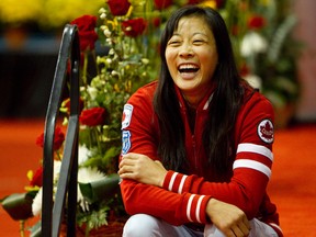 Olympic bronze medallist Carol Huynh shares a laugh with a colleague while attending the 2012 Women's World Wrestling Championships at Millennium Place in Sherwood Park on Saturday.
David Bloom, Edmonton Sun