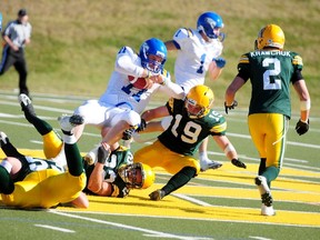 UBC Thunderbirds quarterback Billy Greene gets tripped up by a host of U of A Golden Bears defenders during Saturday’s game at Foote Field. The Thunderbirds rolled to a 29-10 victory.
Trevor Robb, QMI Agency