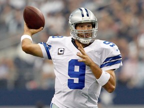 Tony Romo #9 of the Dallas Cowboys looks for an open receiver against the Tampa Bay Buccaneers at Cowboys Stadium on Sept. 23, 2012 in Arlington, Texas.   Tom Pennington/Getty Images/AFP