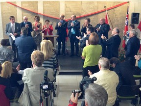 Miller Group president and CEO Leo McArthur, standing far left, is given a standing ovation after delivering a speech during the grand opening ceremonies of the new Julie McArthur Regional Recreation Centre in this October 2012 file photo. Mr. McArthur died Monday.