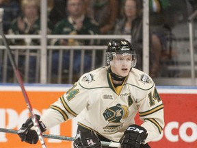 Guelph Storm forward Patrick Watling is dropped to the ice by London Knights defenseman Tommy Hughes during their OHL hockey game at Budweiser Gardens in London on Sunday September 30, 2012.
CRAIG GLOVER The London Free Press / QMI AGENCY