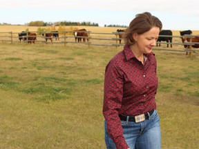 Premier Alison Redford leaves an Airdrie, Alta. area farm following her press conference over beef recalls on Sept. 30, 2012. (JIM WELLS/QMI AGENCY)