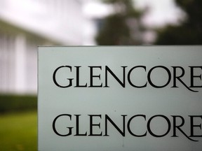 Combination of file photos showing the logo of Glencore in front of the company's headquarters in the Swiss town of Baar and the logo of Swiss mining company Xstrata at their headquaters in Zug March  26, 2008. REUTERS/Michael Buholzer/Files