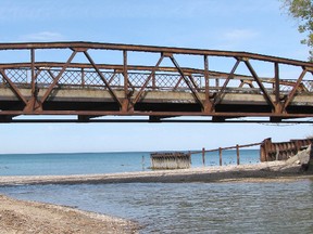 An old bridge that had been used by pedestrians in recent years to cross the Cull Drain along the shore of Lake Huron near Bright's Grove has been fenced off and closed following a recent inspection. The future of the crossing is being studied by city hall. PAUL MORDEN/THE OBSERVER/QMI AGENCY