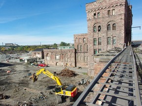 Workers dismantle buildings at the former St. Marys Paper site in Sault Ste. Marie, Ont. on Monday, Oct. 1, 2012. The site's new owner, Riversedge Developments, and the Sault Ste. Marie Innovation Centre, are looking for interest in a bio-energy and technology campus on part of the former industrial site.
MICHAEL PURVIS/SAULT STAR/QMI AGENCY