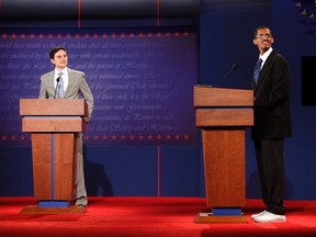 Zach Gonzales (L), stand-in for Republican presidential nominee Mitt Romney, and U.S. President Barack Obama stand-in Dia Mohamed rehearse on stage for the first of the 2012 presidential debates which will be held at the University of Denver in Denver October 2, 2012.  REUTERS/Jim Urquhart