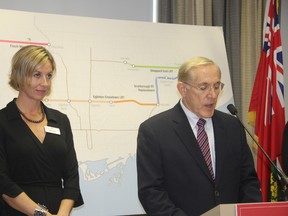 Ontario Transportation Minister Bob Chiarelli announces Thursday the TTC, not Moetrolinx, will operate new LRT lines as TTC chairman Karen Stintz looks on. (Maryam Shah/Toronto Sun)