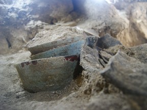 Undated handout picture released by El Peru-Waka Archaeological Project showing ceramic pots found in the royal tomb of Queen K'abel with her funerary regalia, at El Peru-Waka archaeological site in The Lagoon of the Tiger national park in the Mayan biosphere of the Peten departament, 600 km north of Guatemala City. (AFP PHOTO/Proyecto Arqueologico El Peru-Waka)