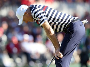 Jim Furyk of the USA reacts to a missed par putt on the 18th green during the Singles Matches for The 39th Ryder Cup at Medinah Country Club.
