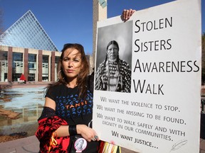 Walk founder April Eve Wiberg holds a sign during the Stolen Sisters Awareness Walk at City Hall in Edmonton, Alberta on Saturday, October 6, 2012.    PERRY MAH/EDMONTON SUN  QMI AGENCY