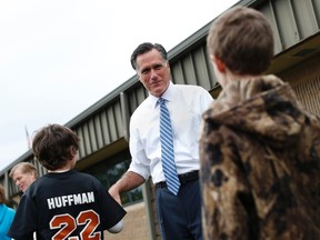 Republican presidential nominee Mitt Romney shakes hands with students from Fairfield Elementary School in Fairfield, Virginia October 8, 2012. REUTERS/Shannon Stapleton