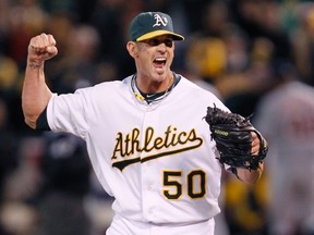 Oakland Athletics relief pitcher Grant Balfour (50) celebrates defeating the Detroit Tigers with a double play to end the 9th inning of Game 3 in their MLB ALDS playoff baseball series in Oakland, California October 9, 2012. (REUTERS)
