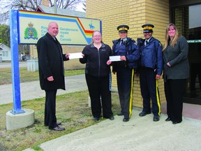 In this file photo, Leanne Traynor of KidSport Manitoba accepted a cheque for $5,000 from the Citizens on Patrol Program (COPP) at the 6th annual golf tournament in 2012. The organization is currently looking for more volunteers. (QMI AGENCY File Photo)