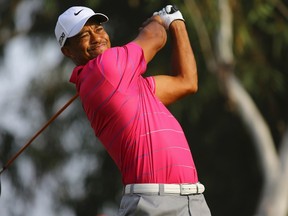 Tiger Woods of the U.S. tees off on the 8th hole during his World Golf Final Group 1 match against Matt Kuchar of the U.S. in Antalya, southern Turkey, October 10, 2012. (REUTERS)